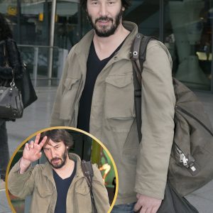 At London's Heathrow Airport, Keanu Reeves appears stylish in casual attire.